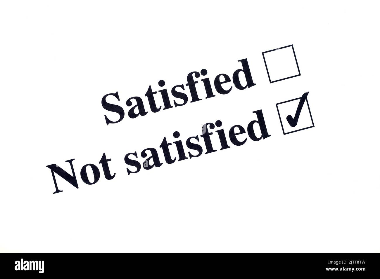 Choice of two tickboxes printed in black on white paper, satisfied and not satisfied. The not satisfied box is ticked, the other is empty. Stock Photo