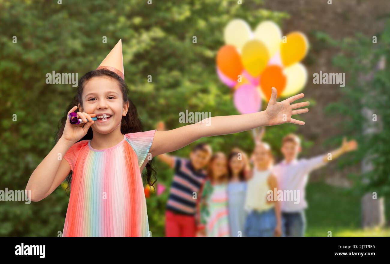 happy girl with blower on birthday party at park Stock Photo - Alamy