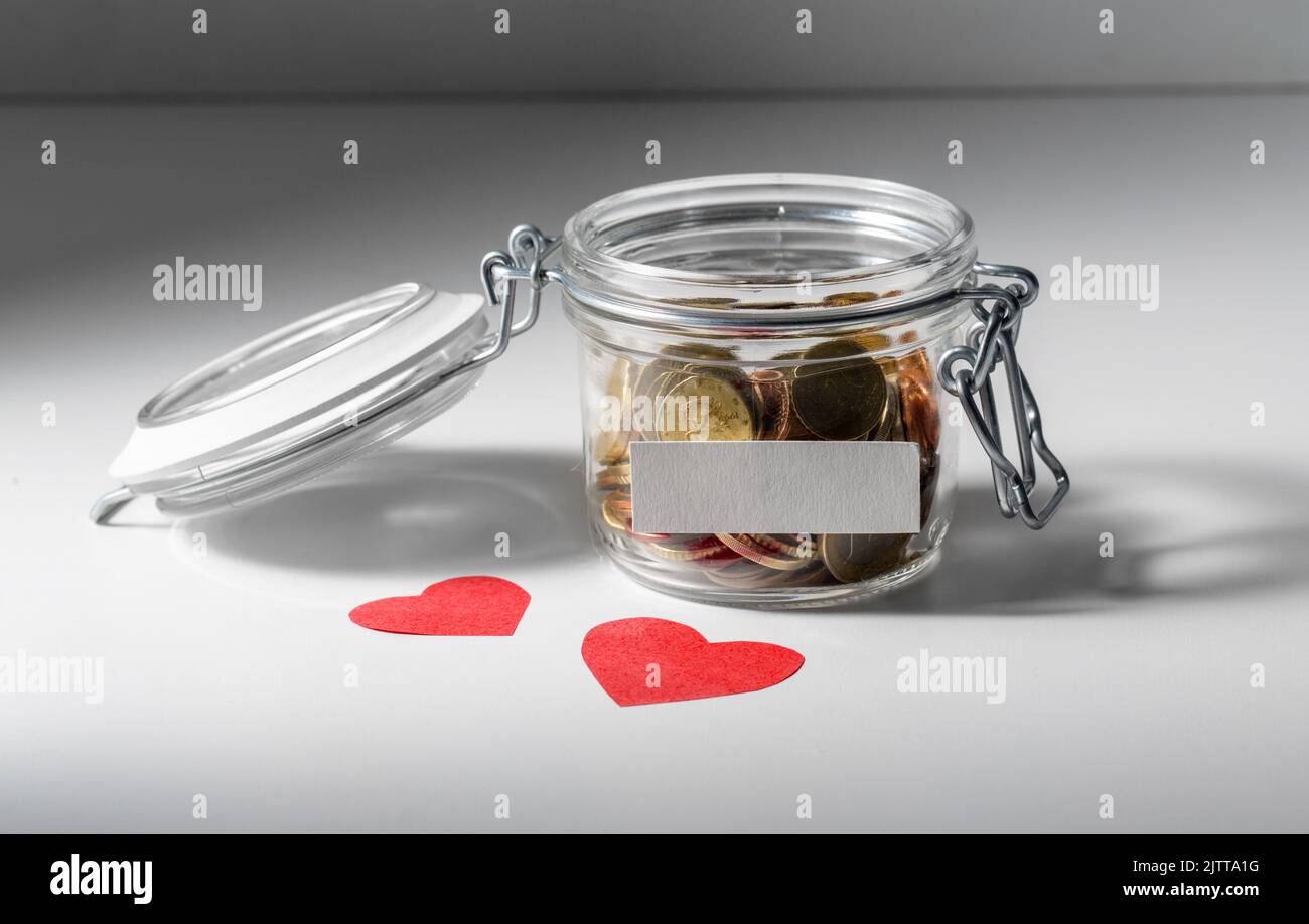 coins in glass jar for donation Stock Photo Alamy