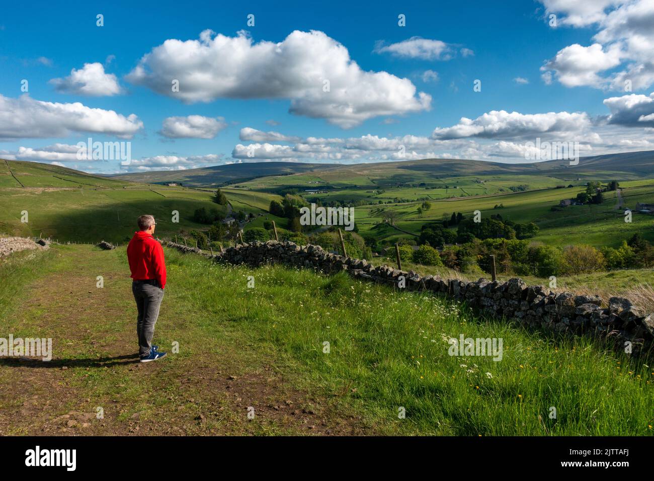 Person enjoying a North Pennine view over Cowshill, Weardale, Country Durham, UK Stock Photo