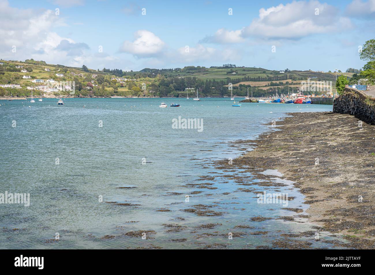 Boats moored in West Glandore Harbour at Union Hall (Bréantrá) in County Cork, Ireland Stock Photo