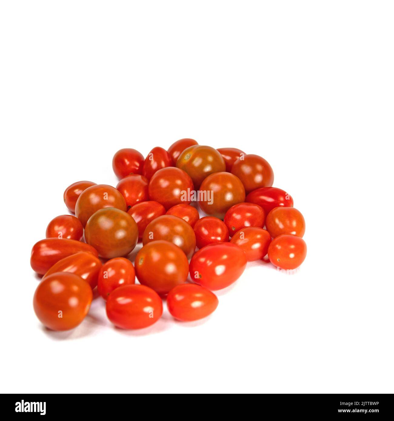 Various mini tomatoes against a white background Stock Photo