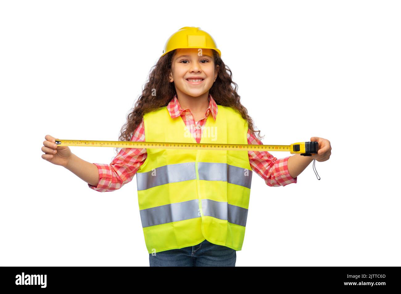 little girl in construction helmet with ruler Stock Photo Alamy