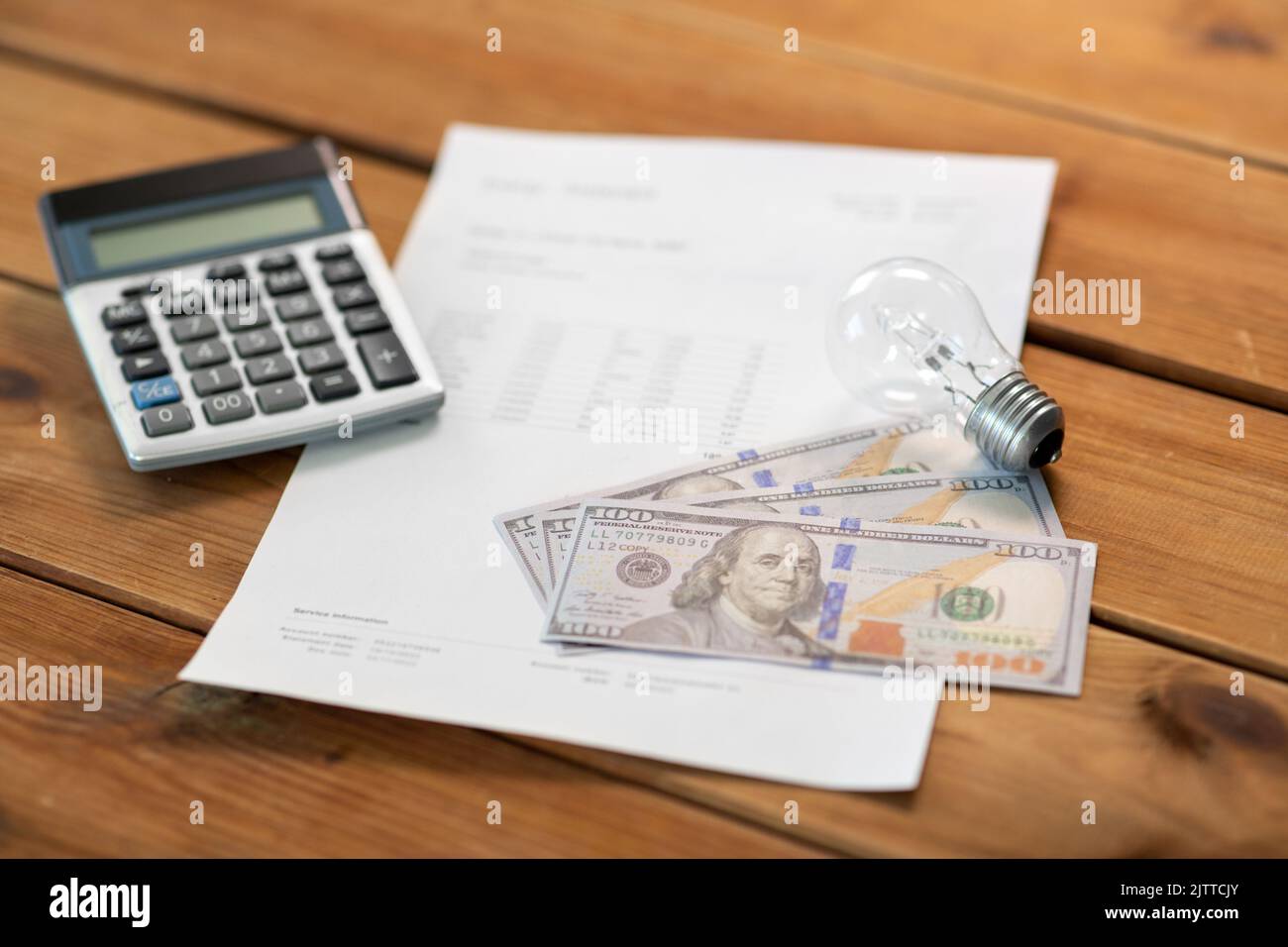 utility bill, calculator, money and lightbulb Stock Photo Alamy