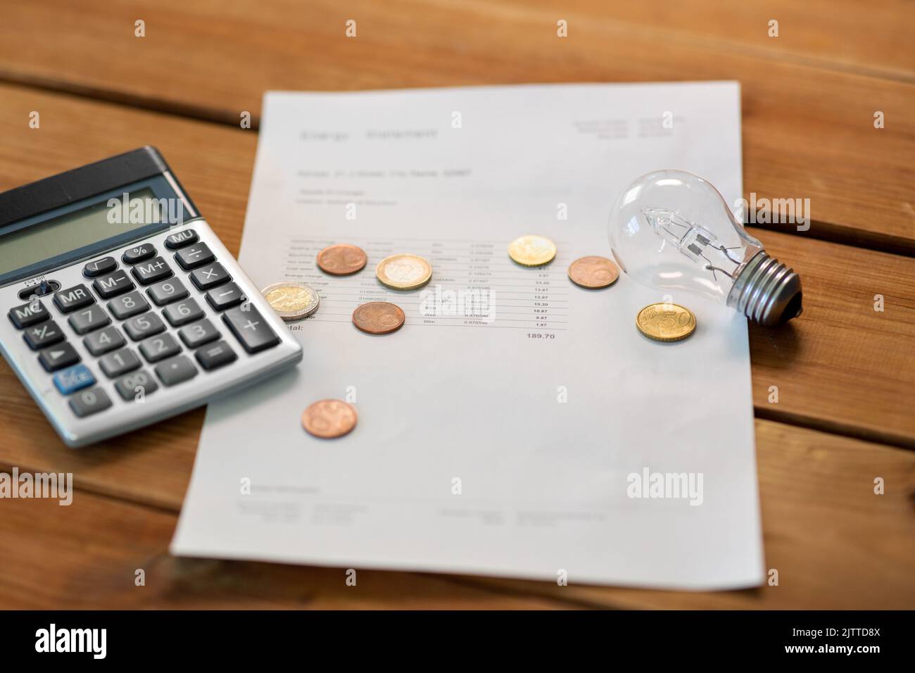 utility bill, calculator, money and lightbulb Stock Photo Alamy