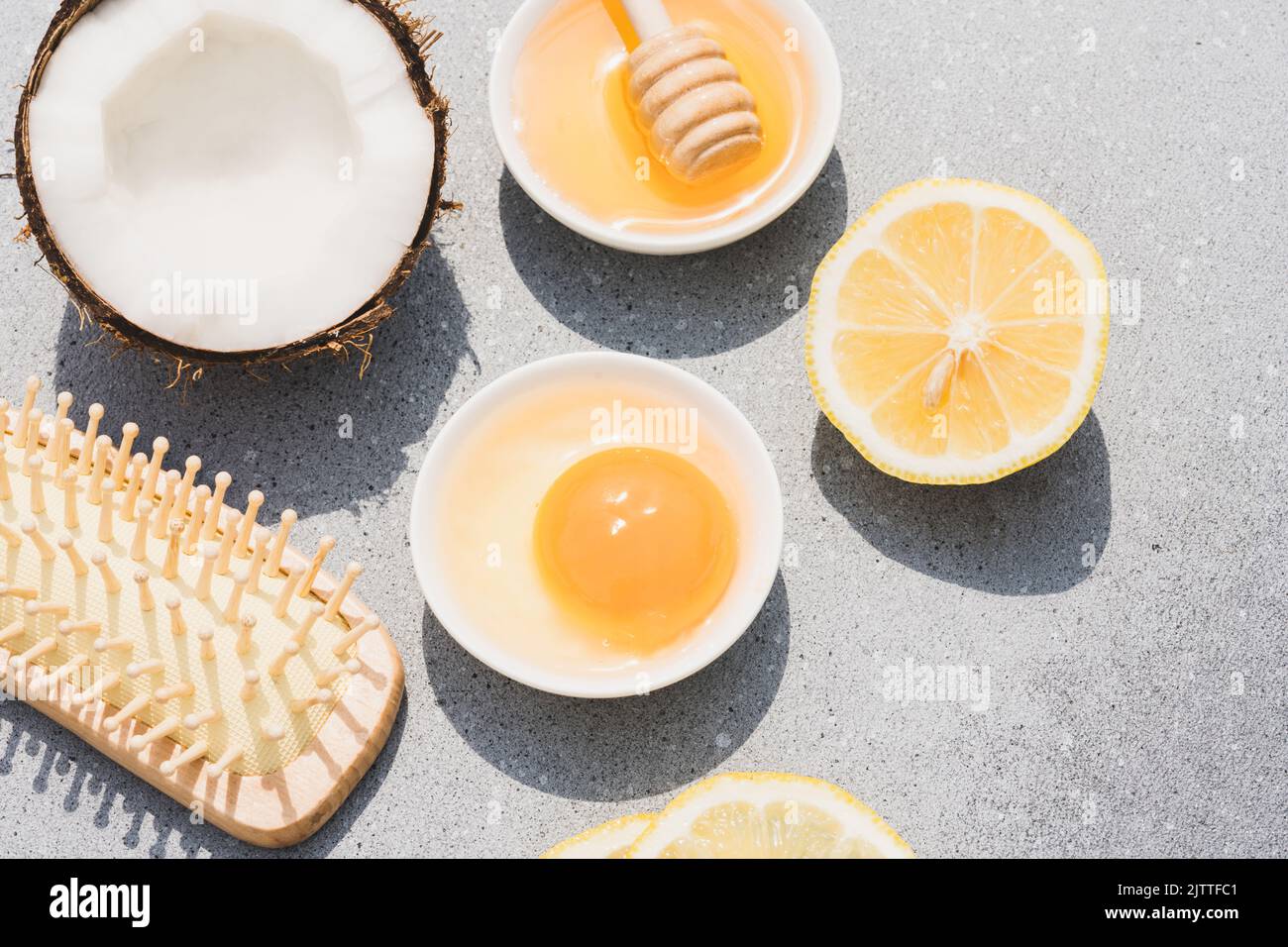Making hair mask at home with natural ingredients - egg yolk, herbal honey,  lemon juice and coconut oil. Natural hair beauty treatment. Zero waste han  Stock Photo - Alamy