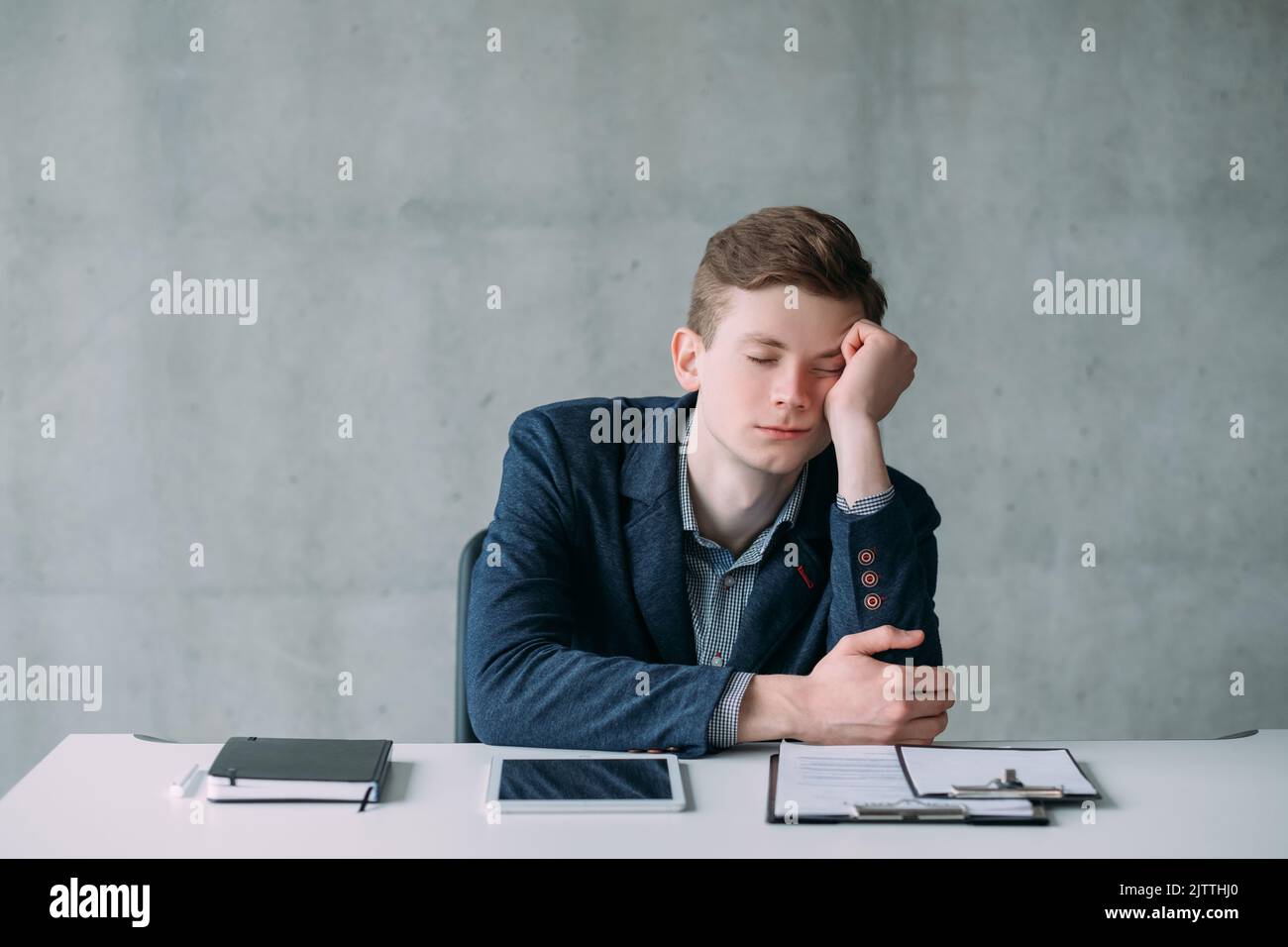 office routine guy sleeping bored no work task Stock Photo