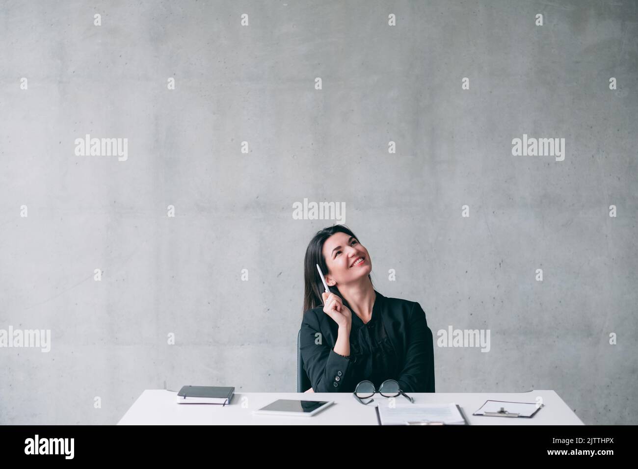 ambitious inspired business woman thinking project Stock Photo