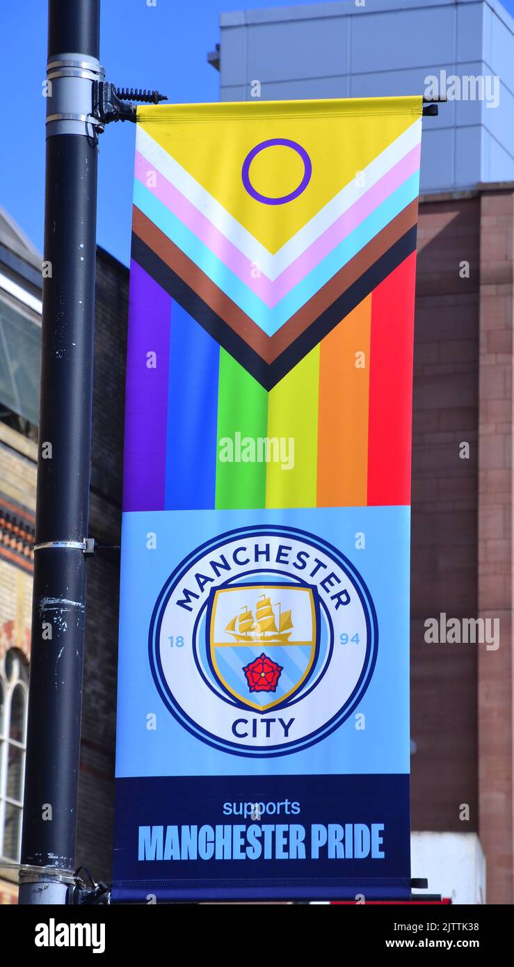 Manchester City Football Club supports Manchester Pride pennants on lampposts in central Manchester, UK. Stock Photo