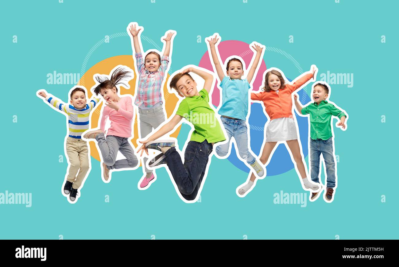 happy kids jumping in air over blue background Stock Photo