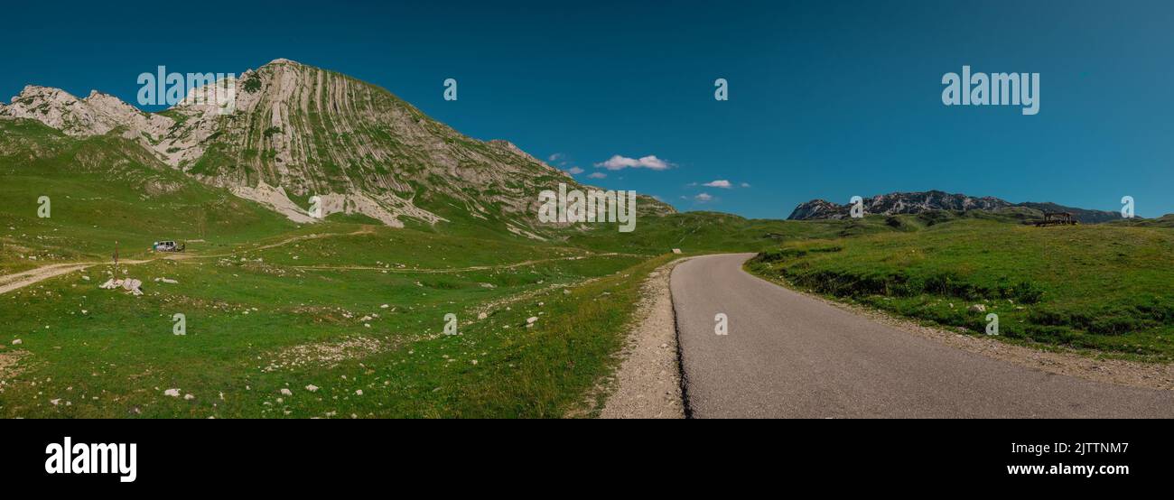 Prutash grand view in durmitor region of crna gora, panoramic view in lush green color in summer time. Awesome and majestic stone wall. Stock Photo