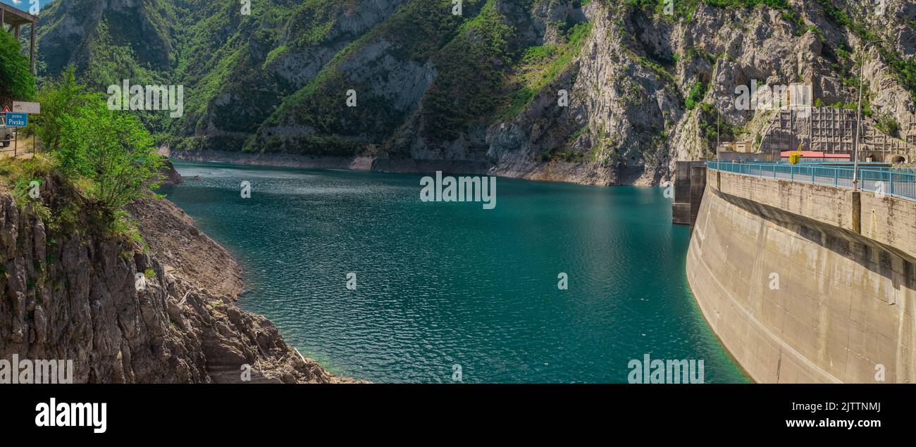 Mratinje hydroelectric power dam in the narrow gorge of Piva river in Montenegro or Crna Gora. Wide panoramic view of deep gorge behind the high concr Stock Photo