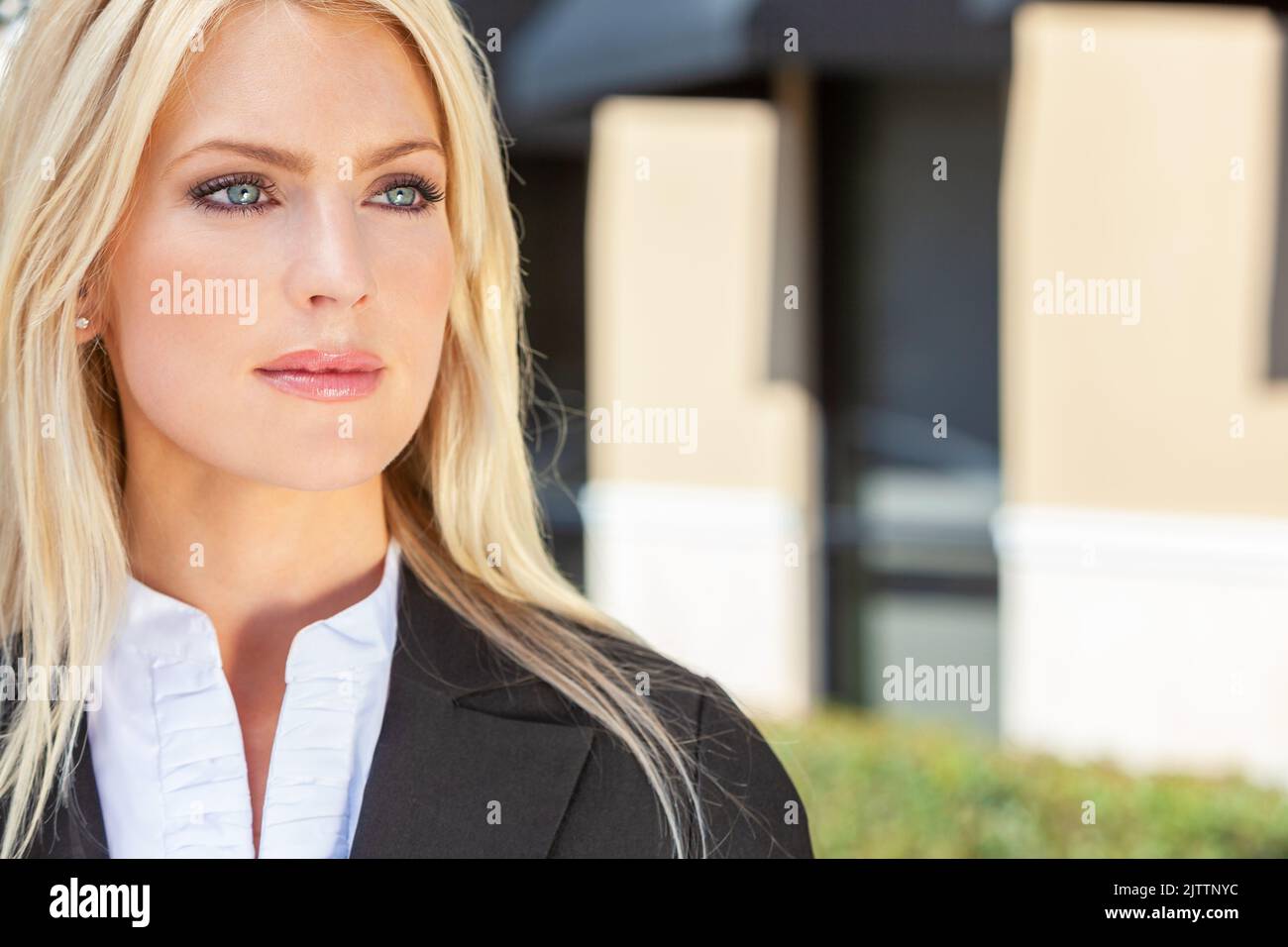 Natural light outdoor portrait of a beautiful blond woman with blue eyes Stock Photo