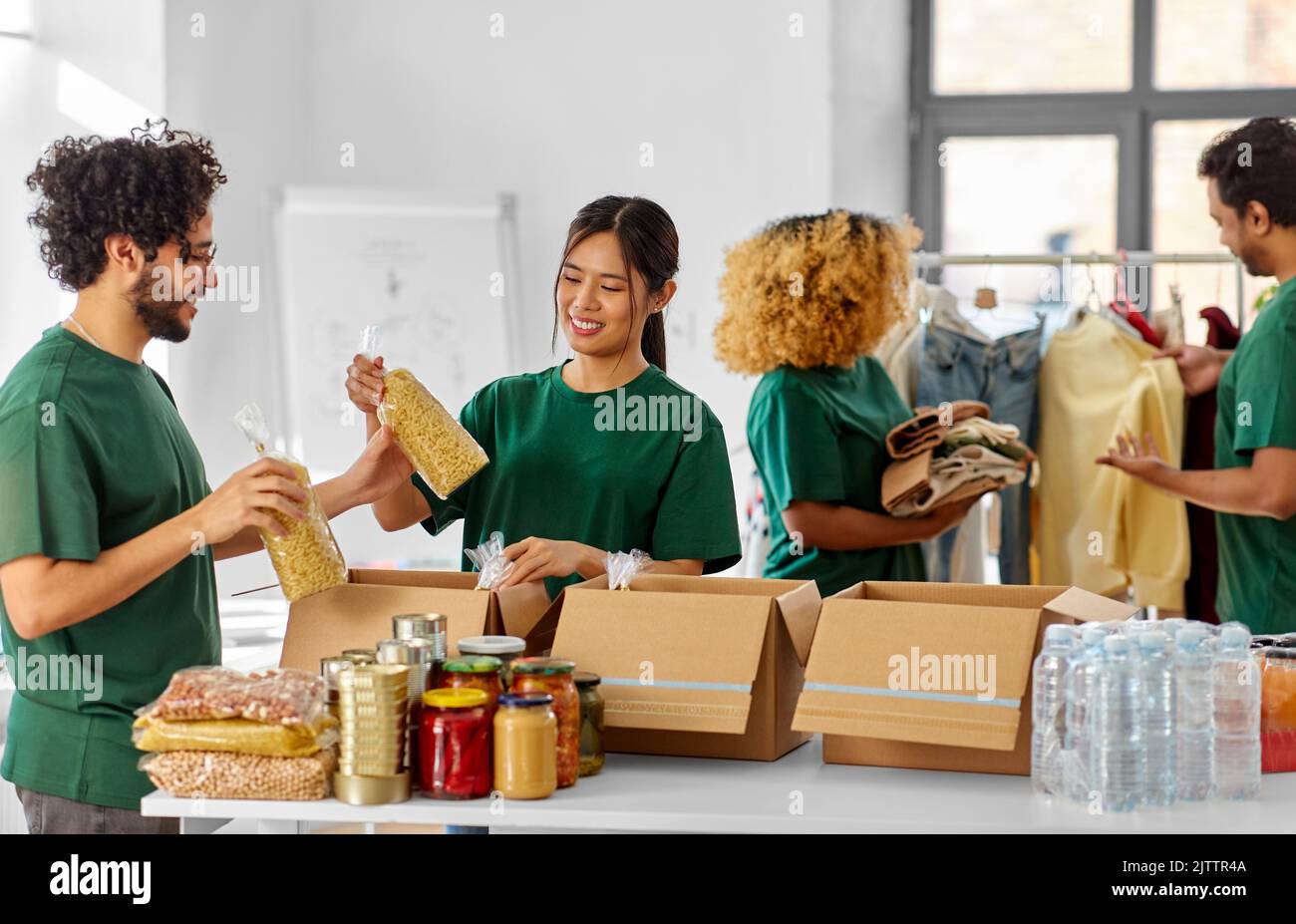 Woman packing clothes boxes hi-res stock photography and images - Alamy
