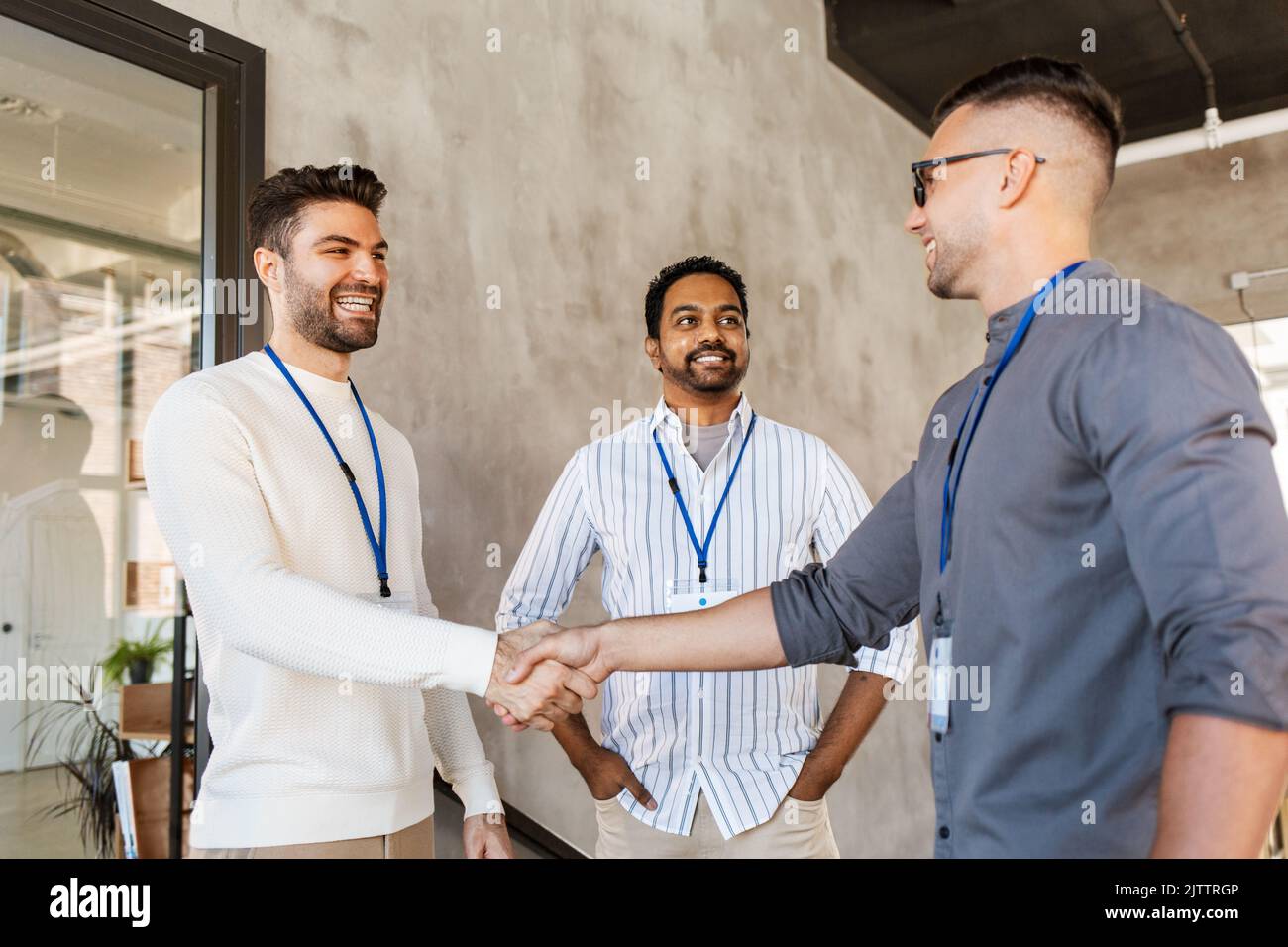 happy businessmen making handshake at office Stock Photo