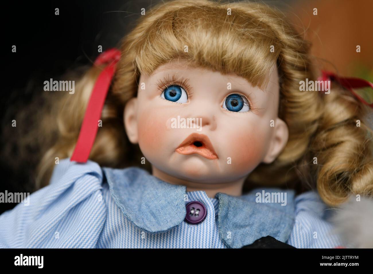 Portrait of a vintage doll girl at the flea market Stock Photo Alamy