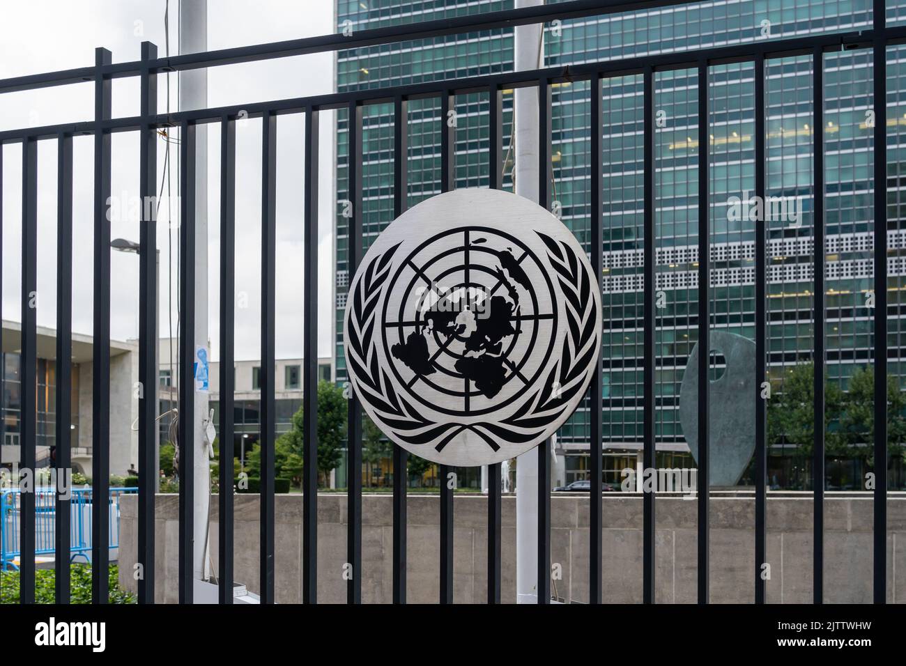 New York City, NY, USA - August 22, 2022: United Nations logo on the fence outside its headquarters in New York City, NY, USA. Stock Photo