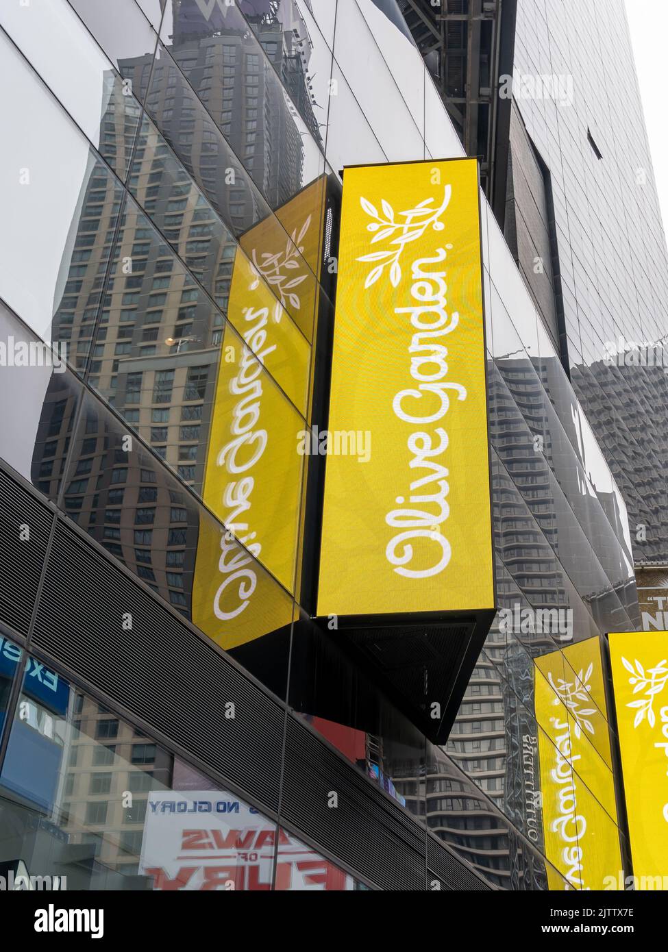 New York City, USA - August 17, 2022: The Olive Garden sign on the building at one  of their restaurants in New York City, USA. Stock Photo