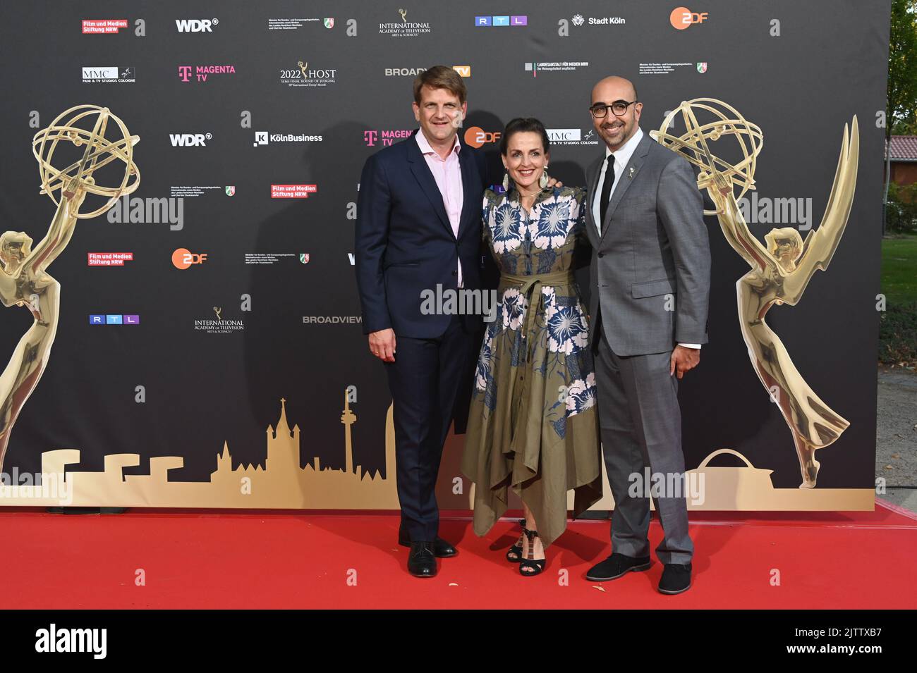 Cologne, Germany. 31st Aug, 2022. Producer Leopold Hoesch (l-r), actress Nicole Ansari-Cox and Emmy Jury Chief Nathaniel Brendel arrive at the evening event during the jury session for the international Emmy Awards 2022 - Semi Final round of Judging of the international Emmy Awards at Schloss Arff. Credit: Horst Galuschka/dpa/Alamy Live News Stock Photo