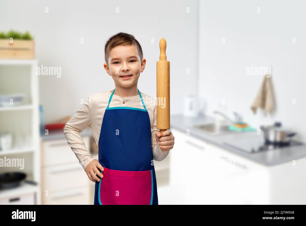 Teen boy cooking in the kitchen hi-res stock photography and images - Alamy
