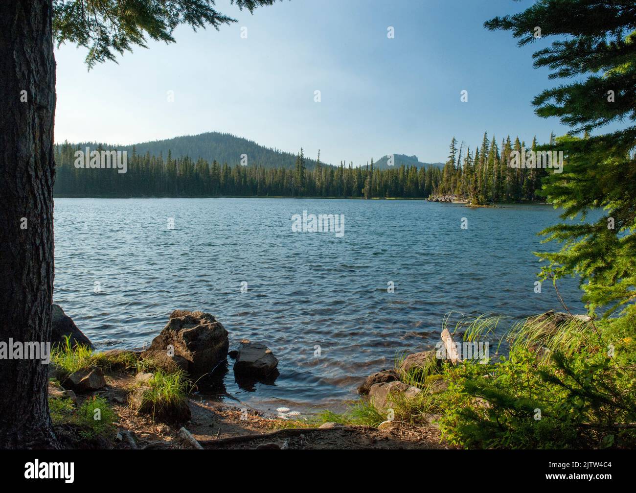 Irish Lake and Irish Mountain, in Oregon's Three Sisters Wilderness, near sundown.  The Pacific Crest Trail passes by on the left side of the photo. Stock Photo