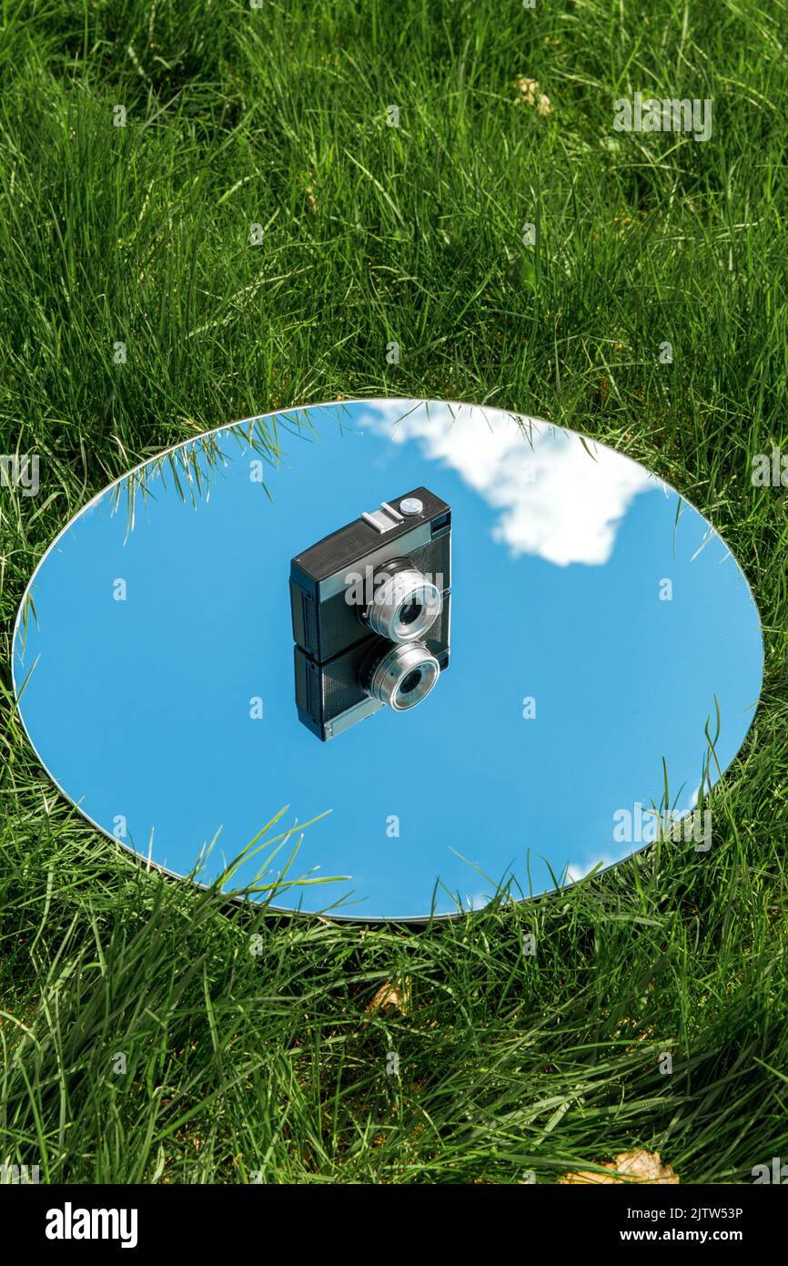 Round mirror on grass hi-res stock photography and images - Alamy