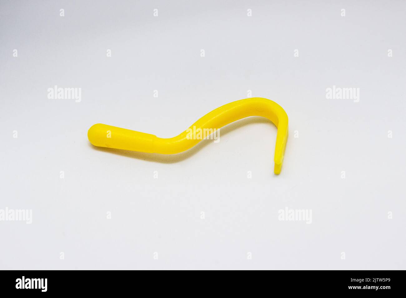 object known as a tick remover, used to remove ticks from people's bodies Stock Photo