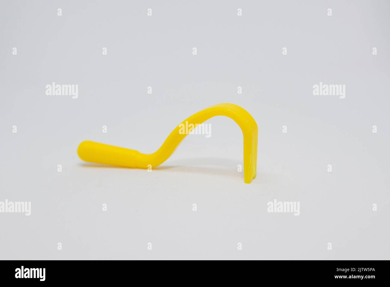 object known as a tick remover, used to remove ticks from people's bodies Stock Photo