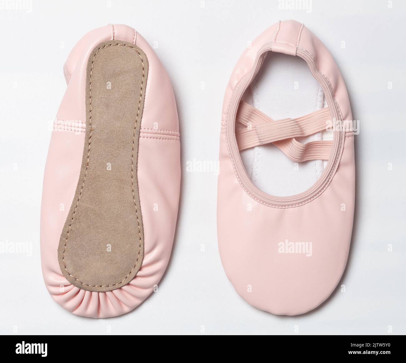 Pink leather ballet shoes above and bottom isolated on white studio
