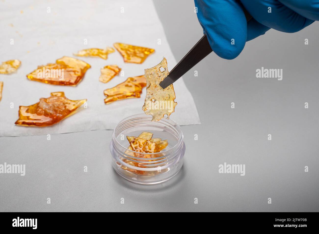 scientific study of cannabis terpenes, pure thc wax in hand Stock Photo Alamy