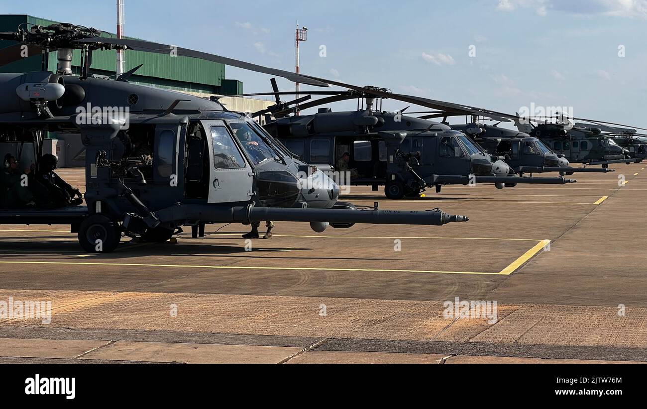 U.S. Air Force HH-60 Pave Hawk helicopters flown by the New York Air National Guard’s 106th Rescue Wing sit ready for launch on Aug. 23, 2022 in Campo Grande, Brazil while participating in Exercise Tapio. The New York Air National Guard sent 100 personnel to participate in the exercise as part of the New York National Guard State Partnership Program relationship with Brazil.((U.S. Air National Guard photo by Maj Michael O'Hagan) Stock Photo