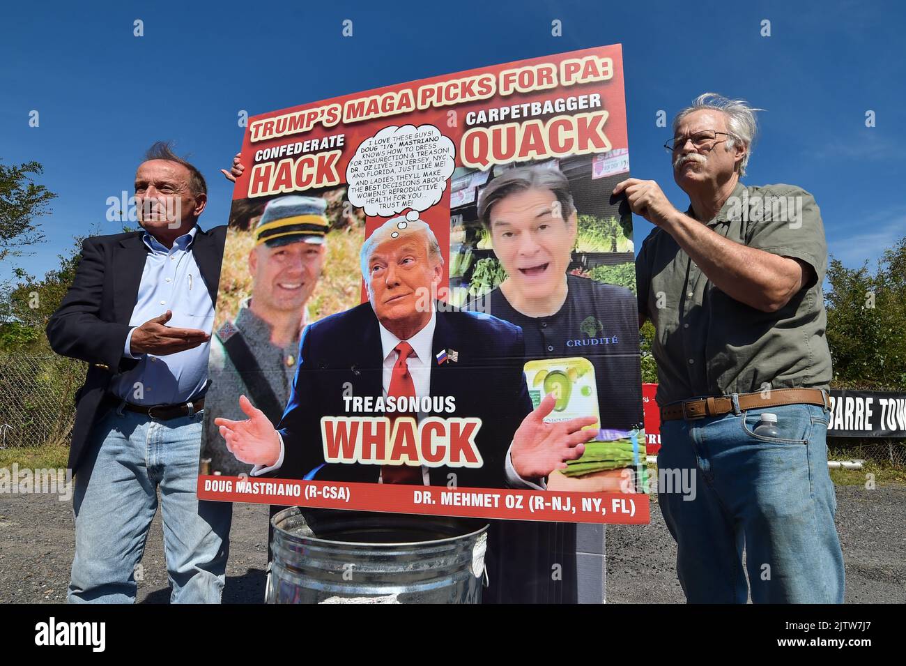 Gene Stilp points at a placard during a protest against Trump. Trump is ...