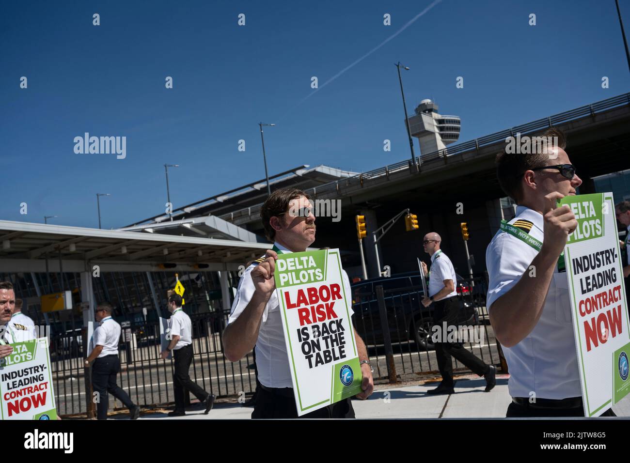 Queens, New York, USA 1st September, 2022 On Thursday before U.S. Labor Day holiday weekend, off-duty Delta Airlines pilots, members of Air Line Pilots Association, picket outside Delta terminal at JFK Airport to protest against lengthy contract negotiations which began in April 2019 and were paused for two years during pandemic, resuming in January of 2022. ALPA says pilots have been flying “historic levels of overtime” due to return of travel demand and said it was picketing at at least one dozen U.S. airports. Stock Photo