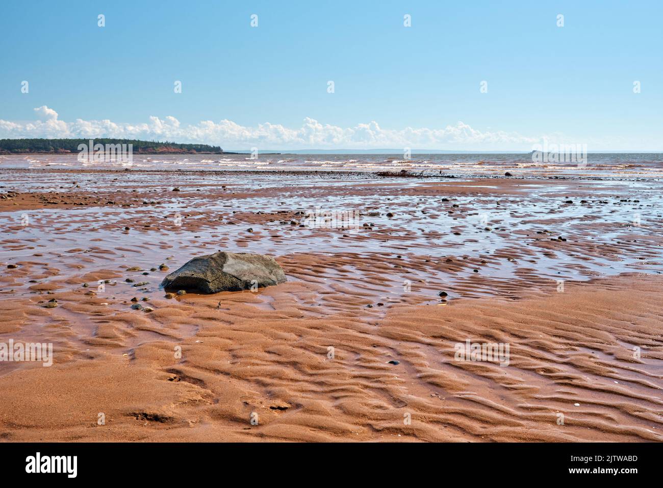 The beach in Economy Nova Scotia is located on the Bay of Fundy where this photograph was taken at low tide. Stock Photo