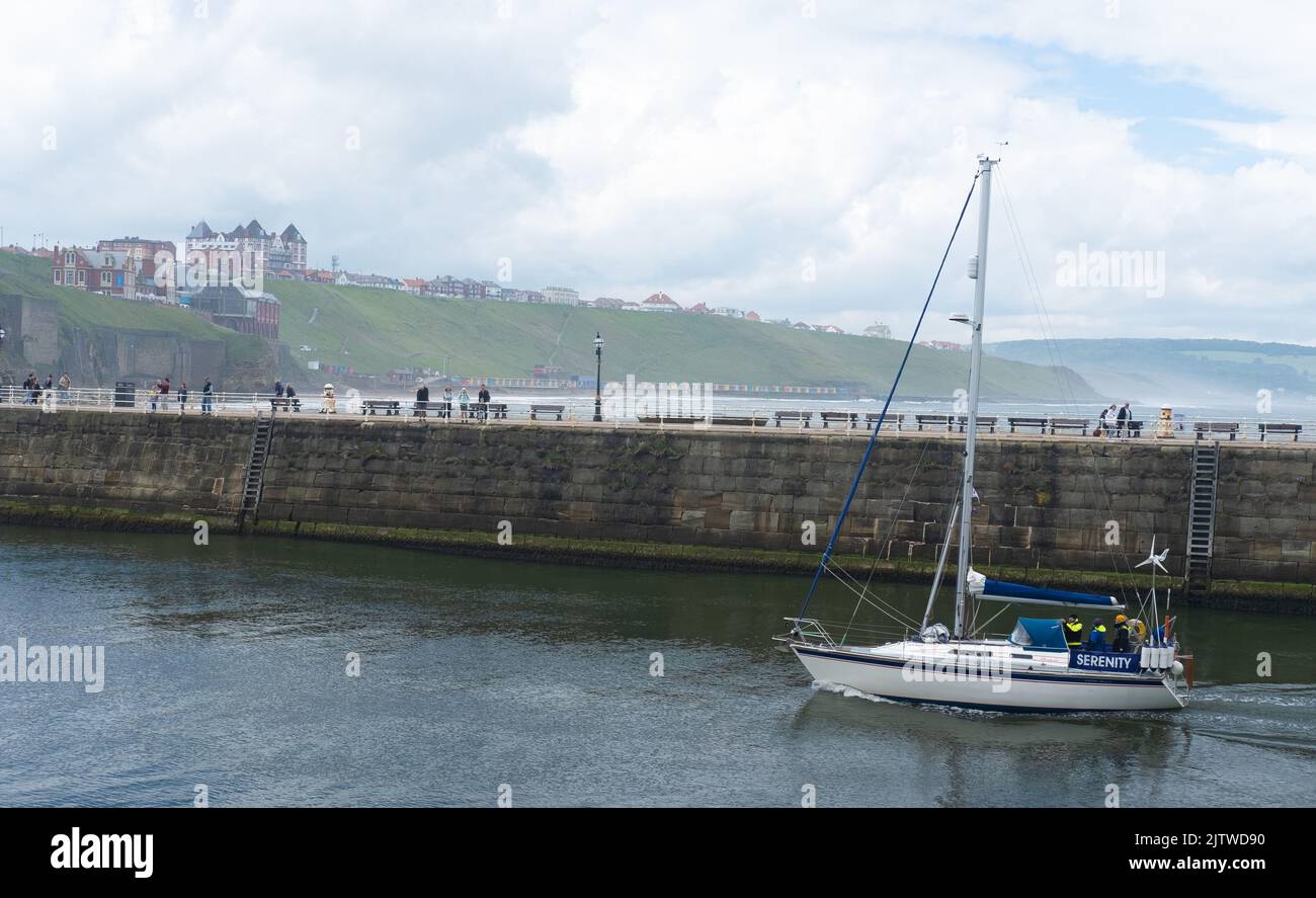 Sailing boat returns to Whitby Harbour Stock Photo Alamy