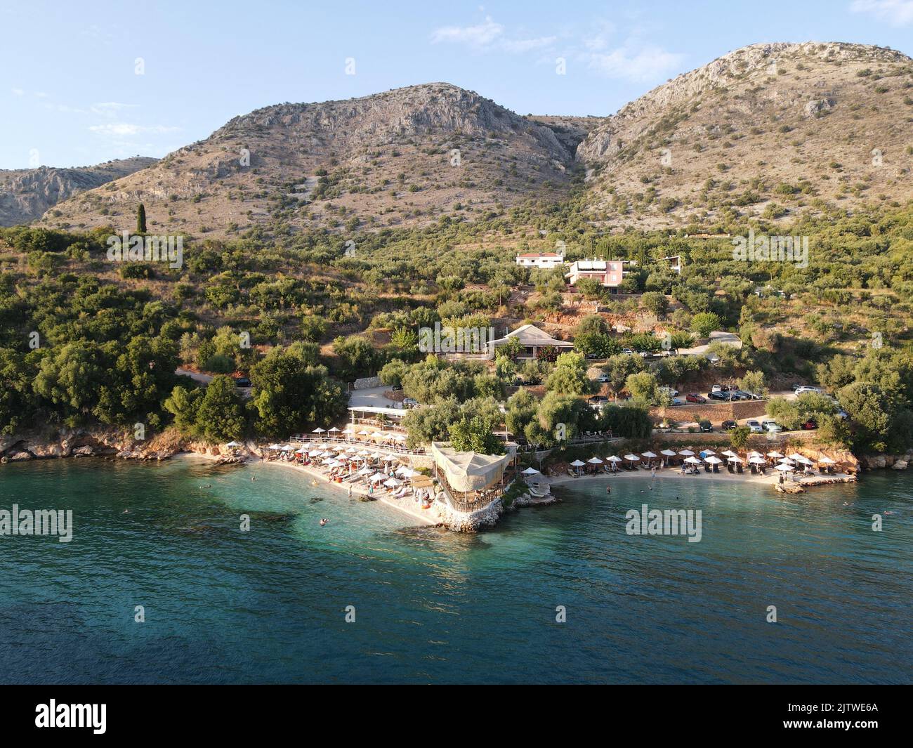 aerial drone view of kokkinos vrachos, red rock, crystal clear water ...