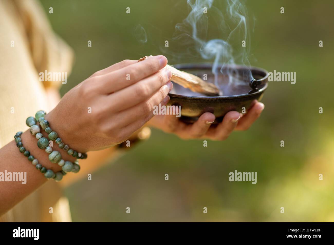 Performing Magic Ritual woman with palo santo performing magic ritual Stock Photo - Alamy