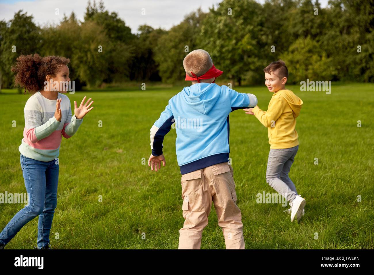 happy children playing and running at park Stock Photo - Alamy