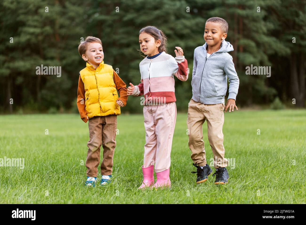 happy children playing and jumping at park Stock Photo - Alamy