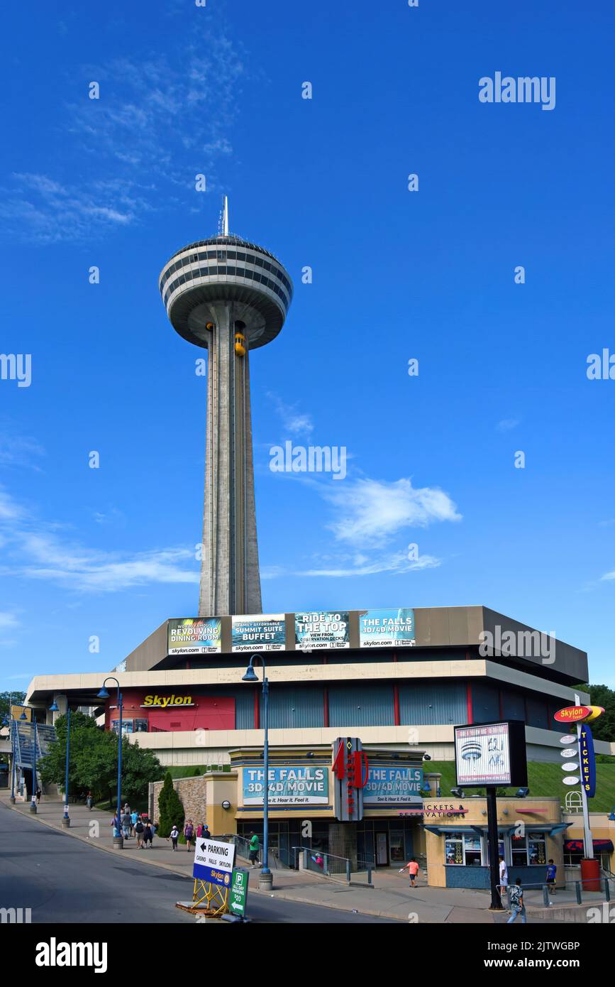 Niagara Falls, Canada - August 13, 2022: Glass-enclosed exterior elevators called Yellow Bugs take tourist to the top of the Skylon Tower Observation Stock Photo