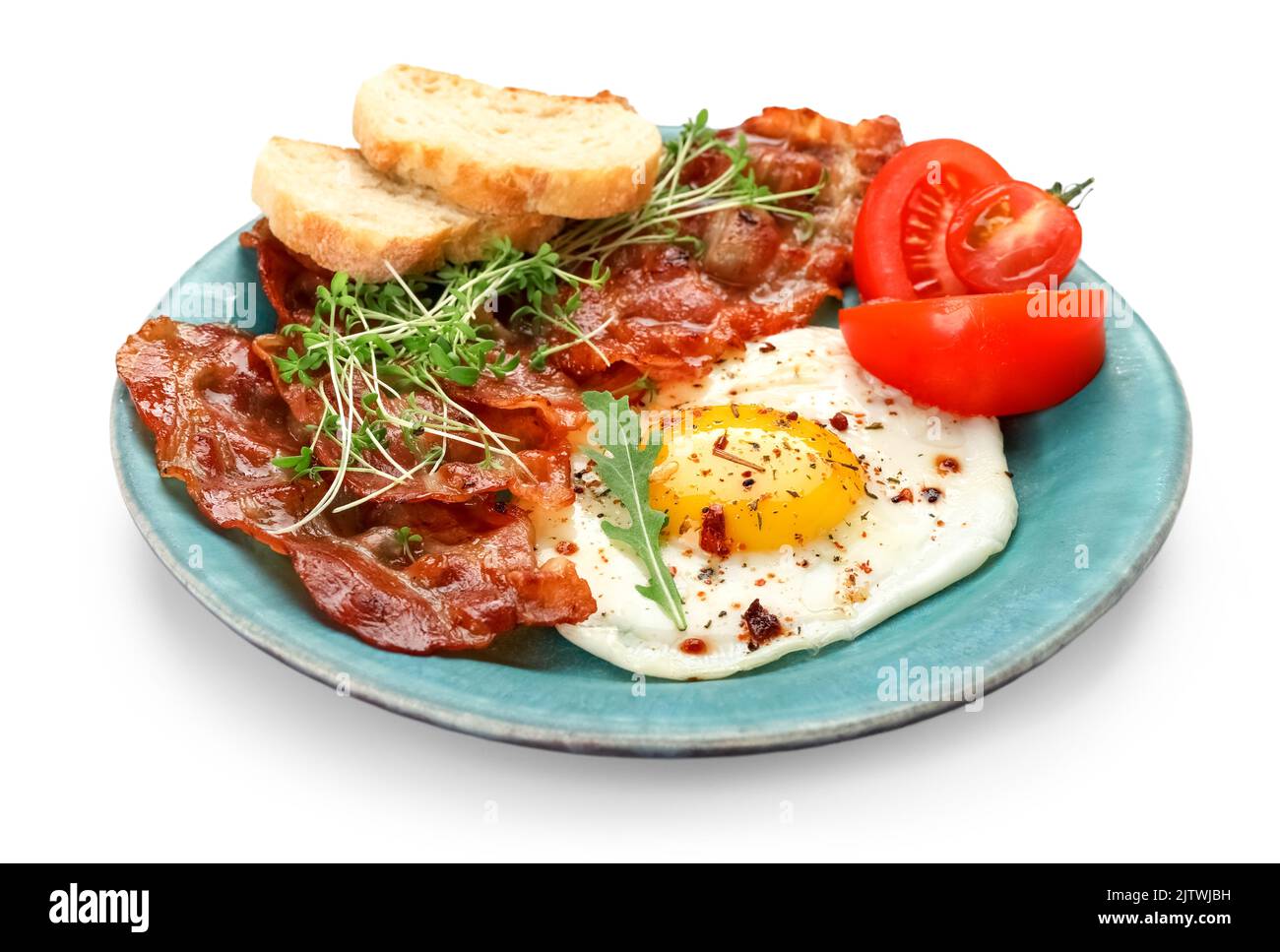 Plate of tasty fried egg and bacon on white background Stock Photo - Alamy