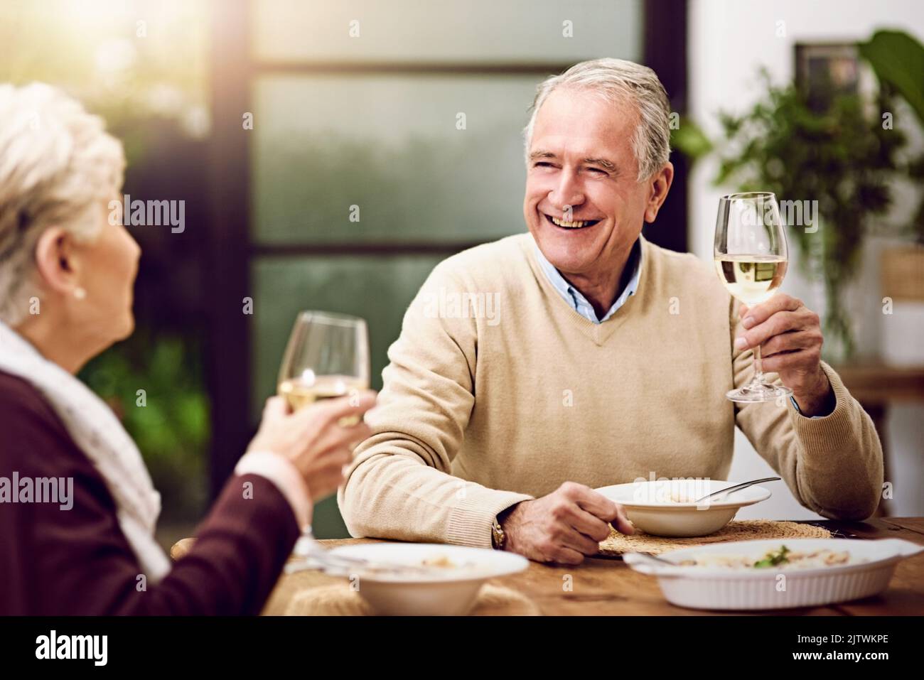 Im so happy to grow old with you. an elderly couple enjoying a meal and