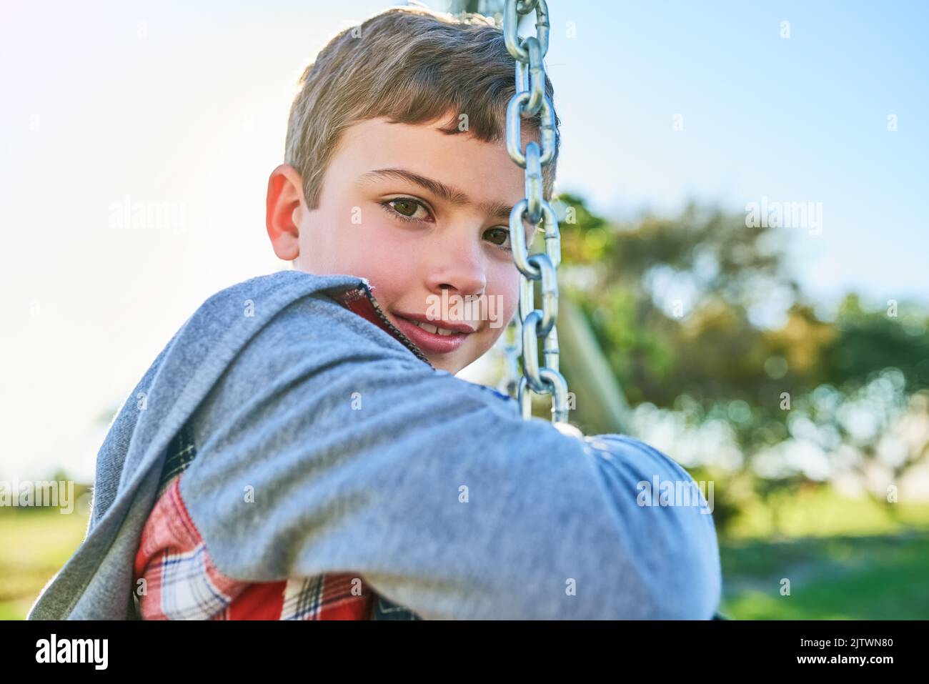 Weekends are meant to be spent at the park. Portrait of a young boy ...