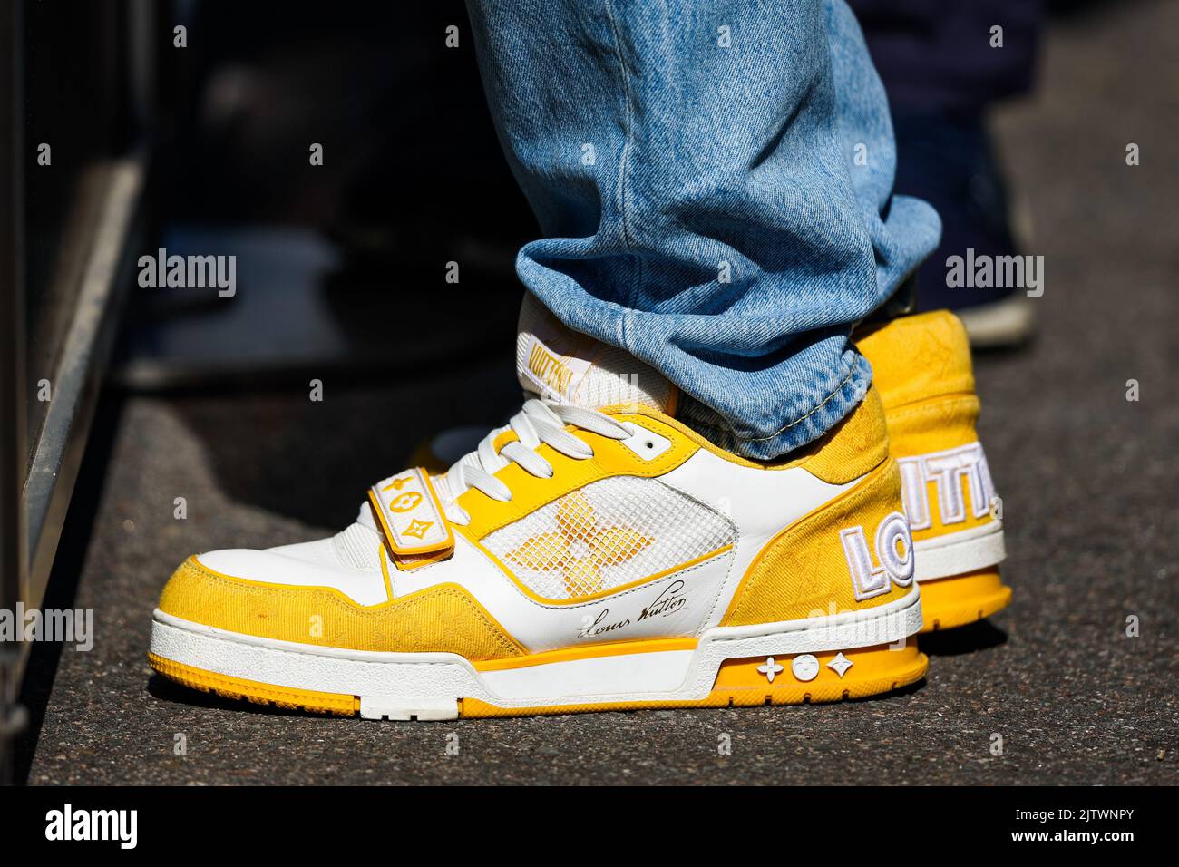 Sneakers LV archlight Louis Vuitton collection 2020. Woman with Louis  Vuitton sneakers walking in the street of Brussels Stock Photo - Alamy