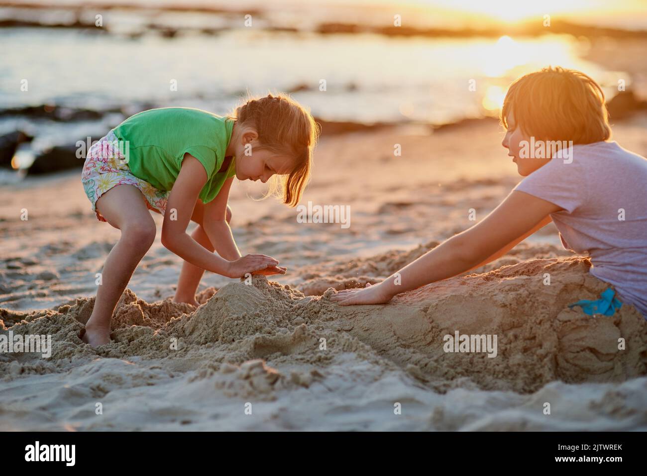 Having a funfilled beach day. two young siblings playing together in