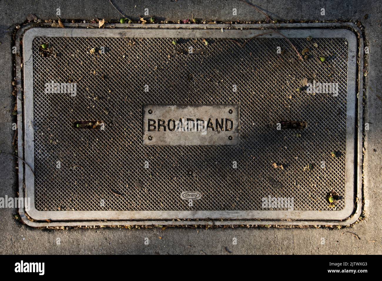 San Leandro, California, USA - November 17, 2021: Late afternoon light shines on a broadband internet utility access panel. Stock Photo