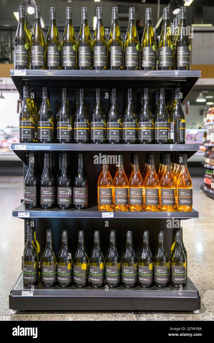Bottles of wine on display on shelves in a supermarket. Photo: David Rowland / One-Image.com Stock Photo