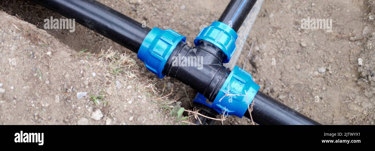 Equipment for automatic watering soil pipes lying in ground closeup