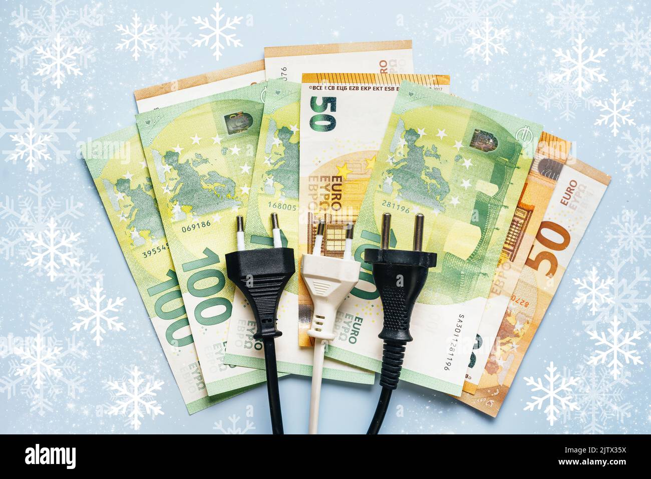 Electric plug lies on euro banknotes showing the drastical inflation on electricity costs at