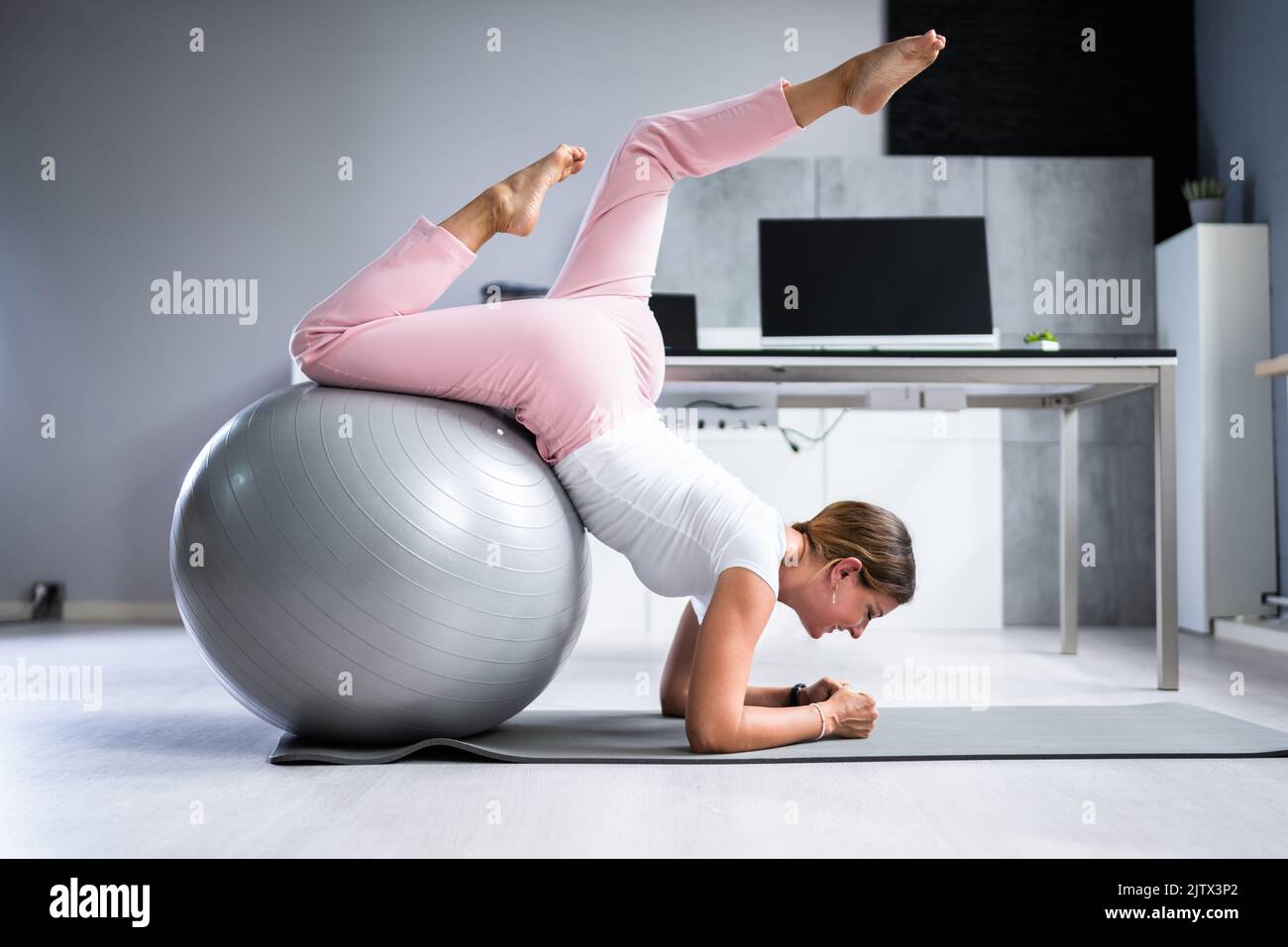 Exercise Workout With Fitness Ball At Office Desk Stock Photo Alamy